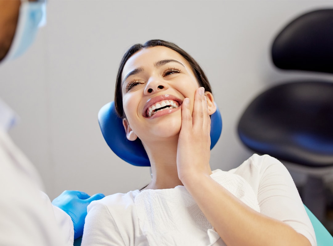 Woman Smiling Holding Jaw